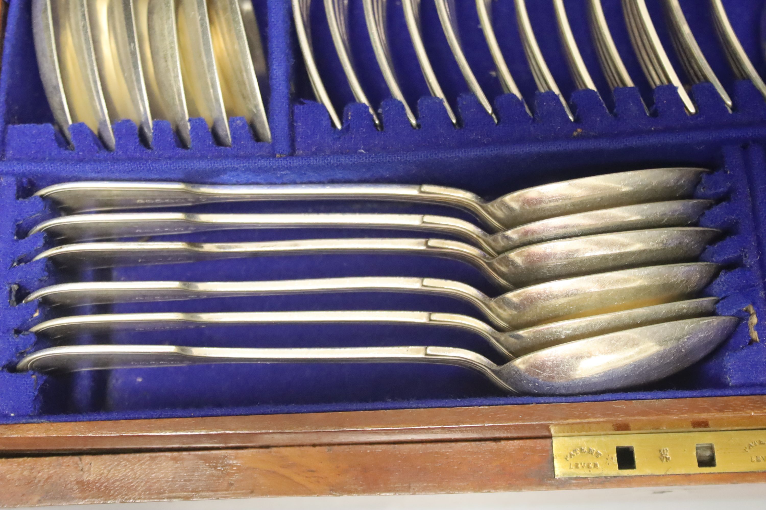 A Victorian silver plate canteen of fiddle and thread pattern flatware for twelve, mahogany cased